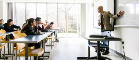 A professor teaching a classroom